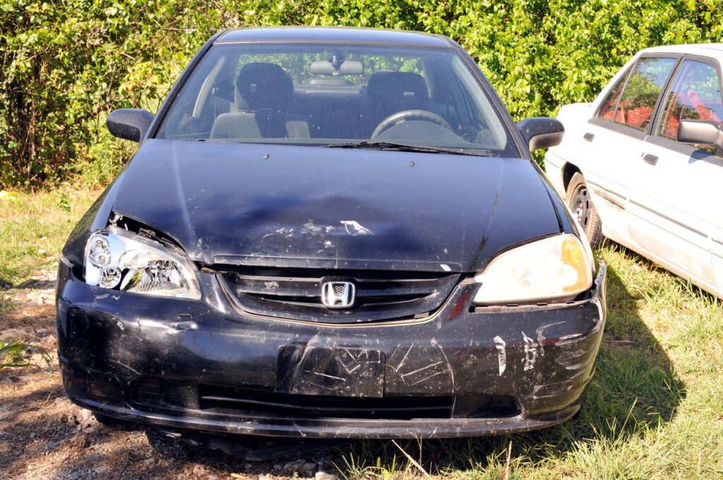 Wrecked Honda Civic in a salvage yard.