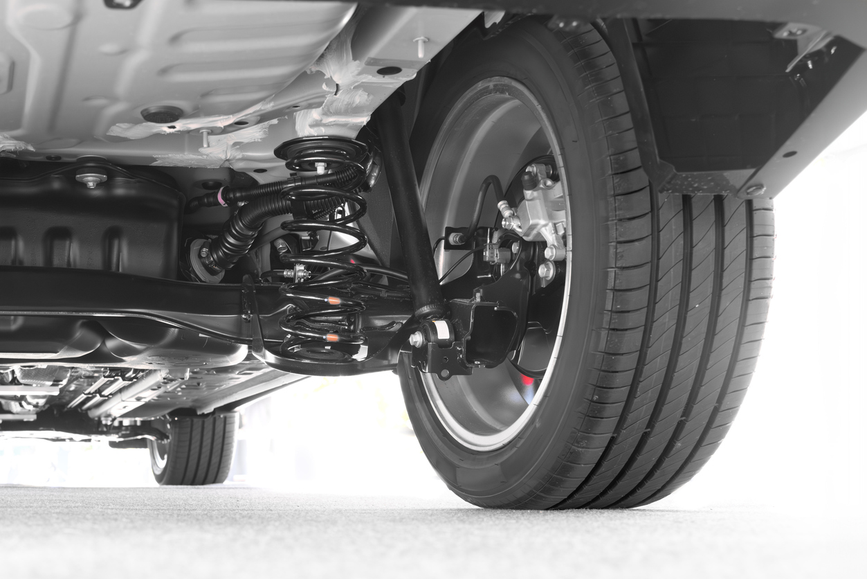 The underside of a car showing a suspension system.